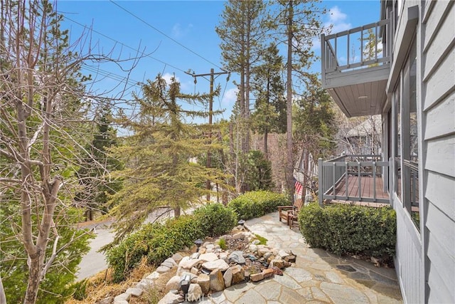 view of yard featuring a balcony