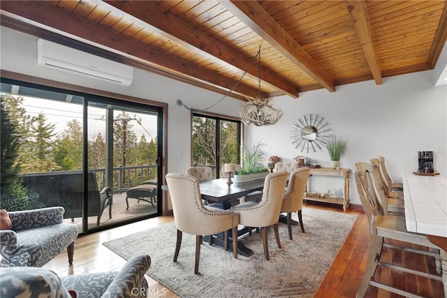 dining room with a chandelier, wooden ceiling, a wall mounted AC, and wood-type flooring