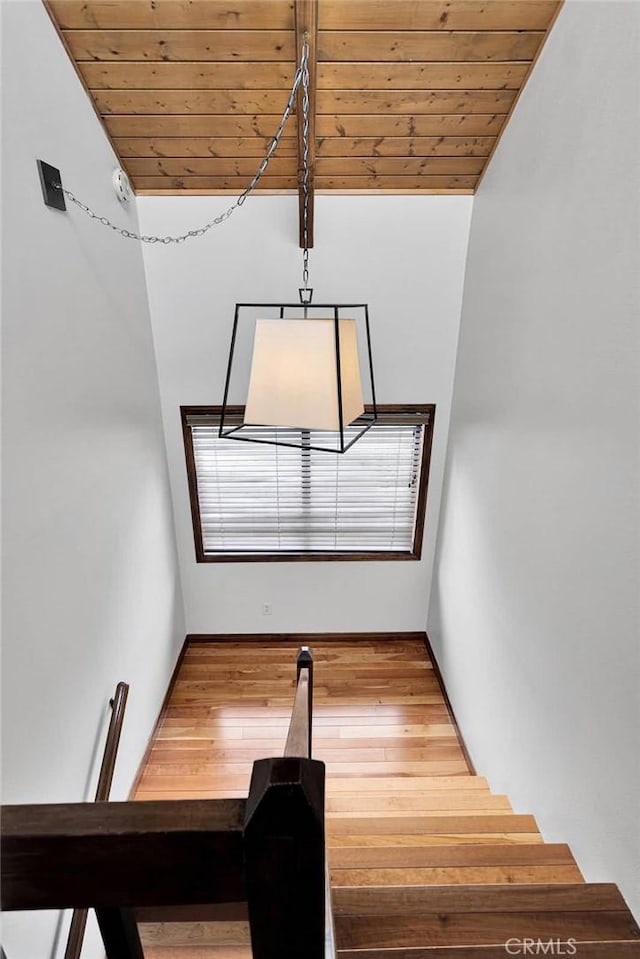 interior space featuring wooden ceiling and wood finished floors