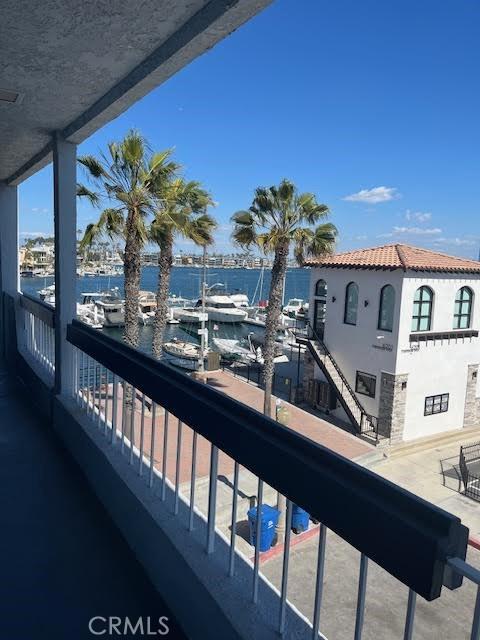 balcony featuring a water view