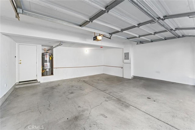 garage featuring electric panel, secured water heater, and a garage door opener