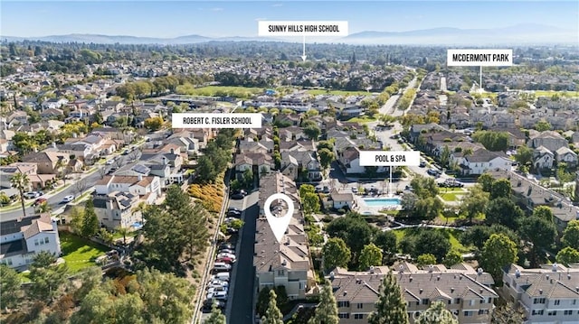 drone / aerial view with a mountain view and a residential view