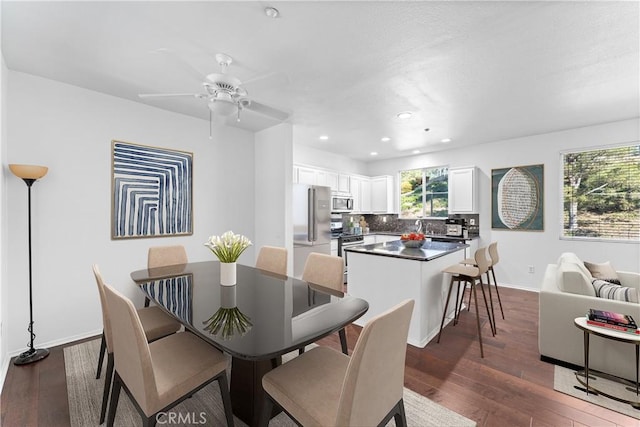 dining room with recessed lighting, dark wood-type flooring, baseboards, and ceiling fan