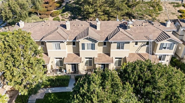 birds eye view of property with a residential view