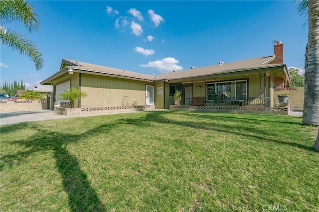 single story home featuring a garage, a chimney, and a front lawn