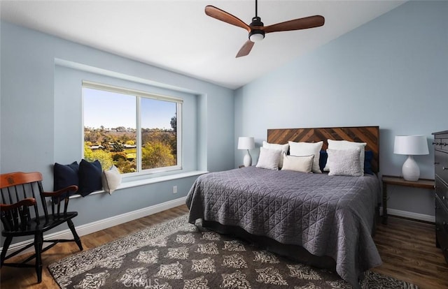 bedroom featuring baseboards, a ceiling fan, lofted ceiling, and wood finished floors