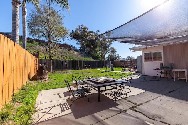 view of patio featuring outdoor dining area and a fenced backyard