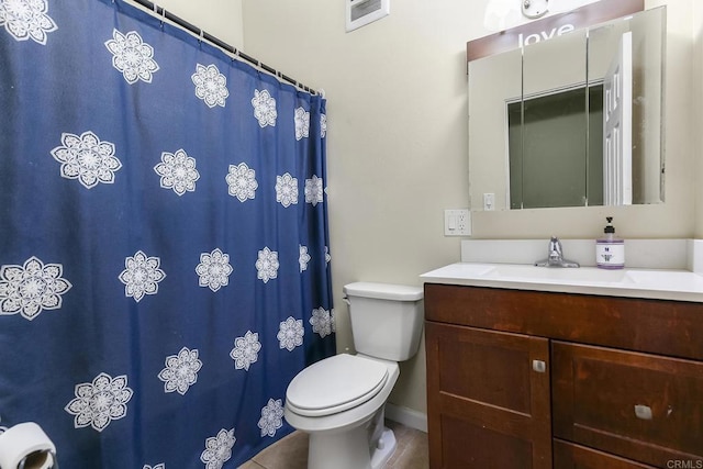 bathroom featuring visible vents, curtained shower, toilet, and vanity