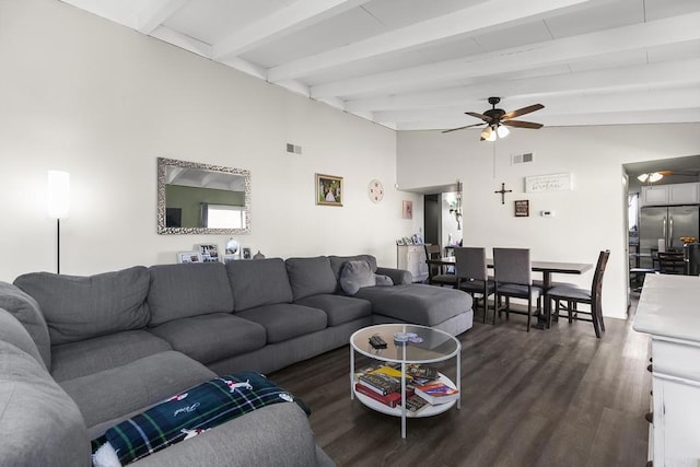 living area featuring ceiling fan, visible vents, dark wood finished floors, and vaulted ceiling with beams