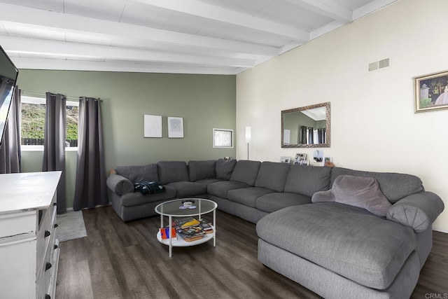 living area featuring dark wood finished floors, beam ceiling, and visible vents