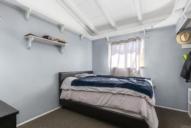 bedroom with beamed ceiling, carpet floors, and baseboards