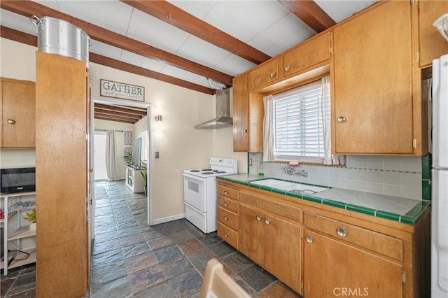 kitchen with white electric range, wall chimney range hood, stone tile flooring, and a sink