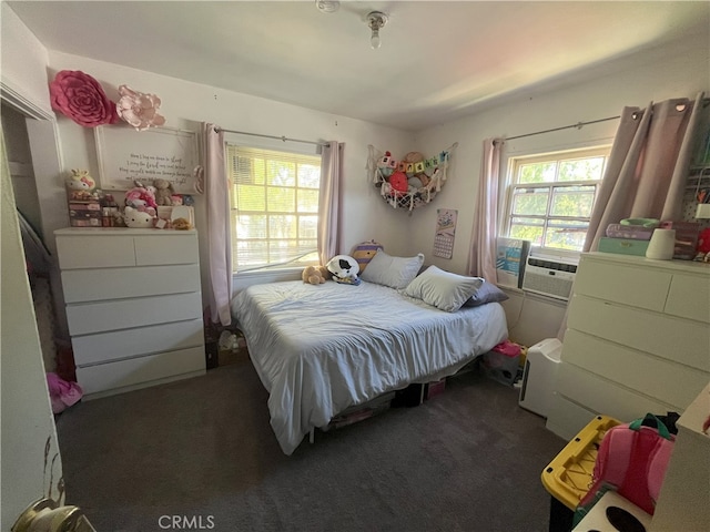 bedroom with cooling unit and carpet