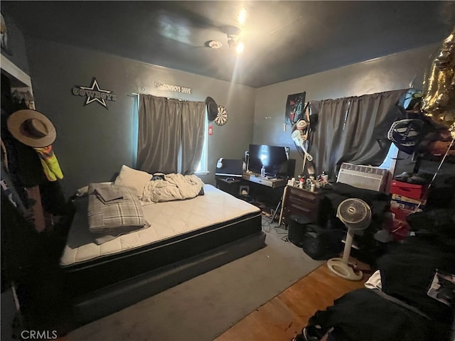 bedroom featuring wood finished floors