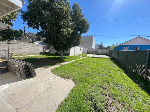 view of yard featuring a patio area and a fenced backyard