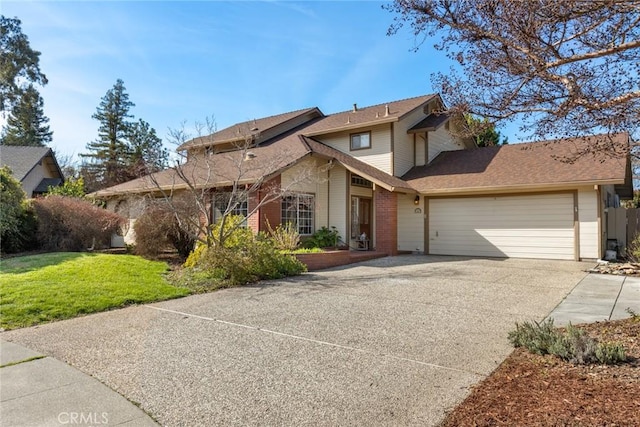 traditional-style house featuring brick siding, an attached garage, concrete driveway, and a front yard