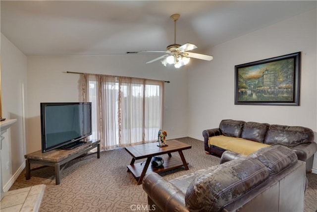 carpeted living area featuring visible vents, baseboards, ceiling fan, and vaulted ceiling