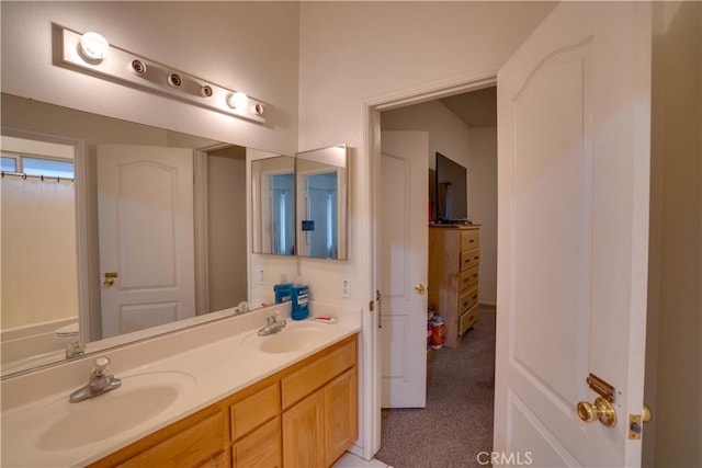 full bath featuring a sink and double vanity