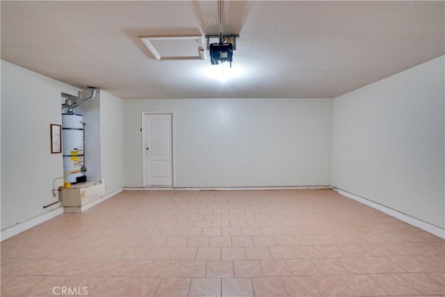 garage featuring strapped water heater and a garage door opener