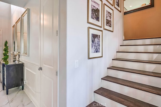 stairway with marble finish floor