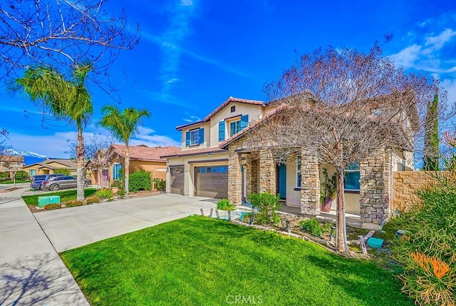 view of front of home with fence, a front yard, stucco siding, a garage, and driveway