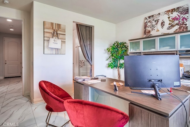 home office featuring baseboards and marble finish floor