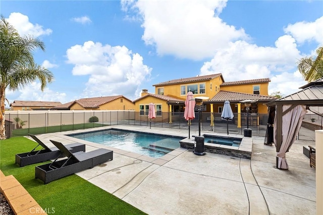 view of pool with a gazebo, a fenced in pool, an in ground hot tub, and a fenced backyard