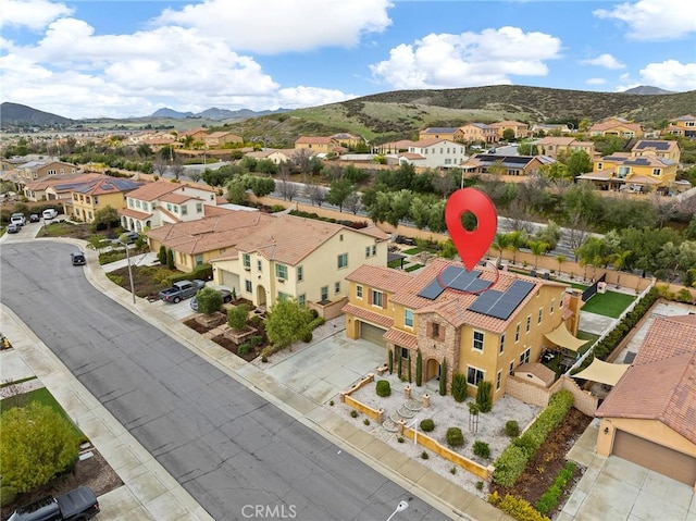 aerial view featuring a mountain view and a residential view