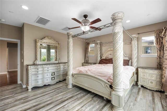 bedroom featuring recessed lighting, wood finished floors, visible vents, and ceiling fan