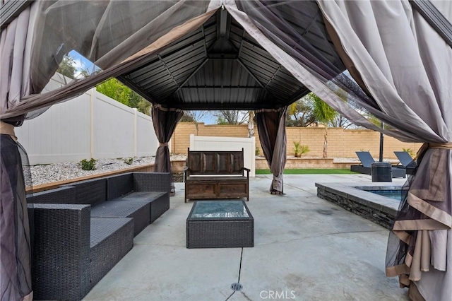 view of patio with an outdoor living space and a fenced backyard