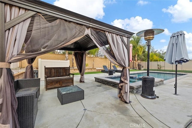 view of patio featuring outdoor lounge area, a gazebo, a fenced backyard, and a fenced in pool