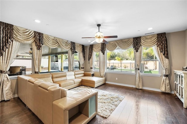 living room featuring visible vents, a ceiling fan, dark wood-style floors, recessed lighting, and baseboards