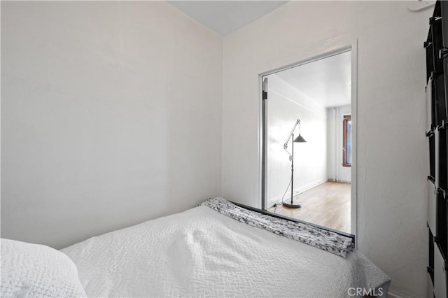 bedroom featuring wood finished floors