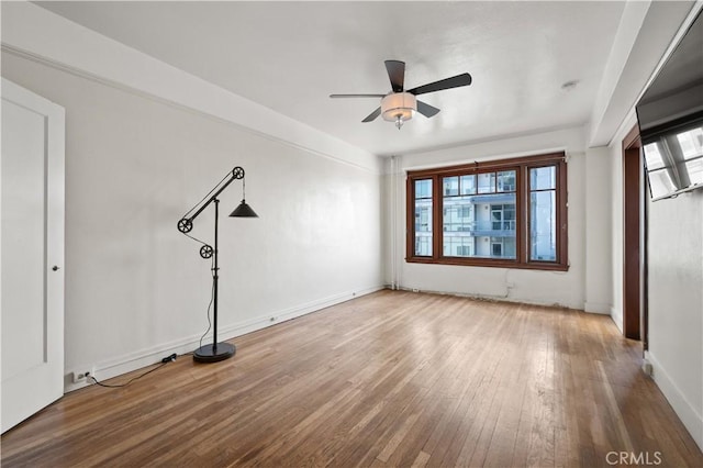 spare room with ceiling fan and hardwood / wood-style floors