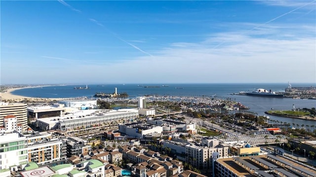 birds eye view of property with a water view and a city view