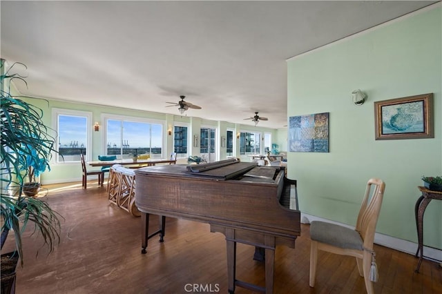 interior space with wood finished floors and baseboards