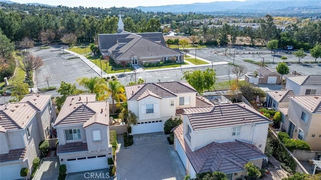 drone / aerial view featuring a residential view and a mountain view