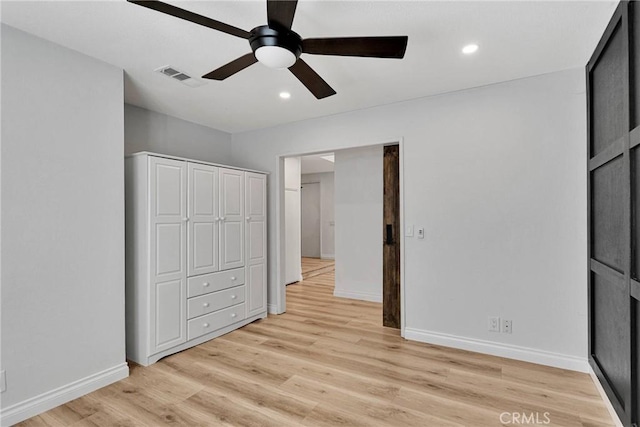 12899 Rain Shadow Rd, Victorville, CA 92395 - unfurnished bedroom featuring light wood-type flooring, visible vents, baseboards, and recessed lighting