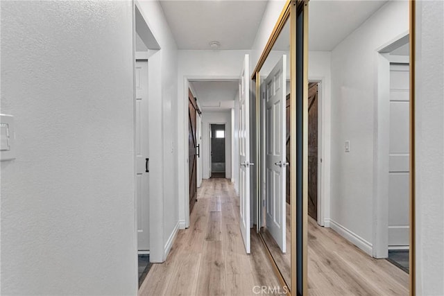 12899 Rain Shadow Rd, Victorville, CA 92395 - corridor with baseboards and light wood finished floors