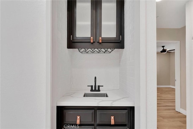 12899 Rain Shadow Rd, Victorville, CA 92395 - bathroom featuring backsplash, vanity, baseboards, and wood finished floors