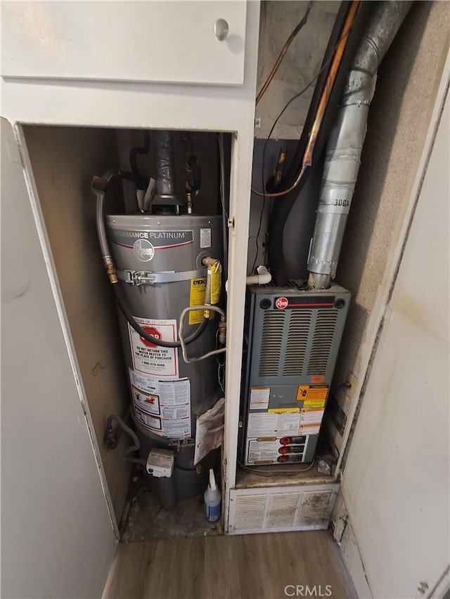 utility room with secured water heater