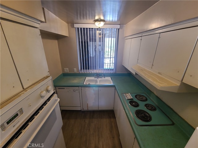 kitchen featuring a sink, white appliances, dark wood finished floors, and white cabinetry