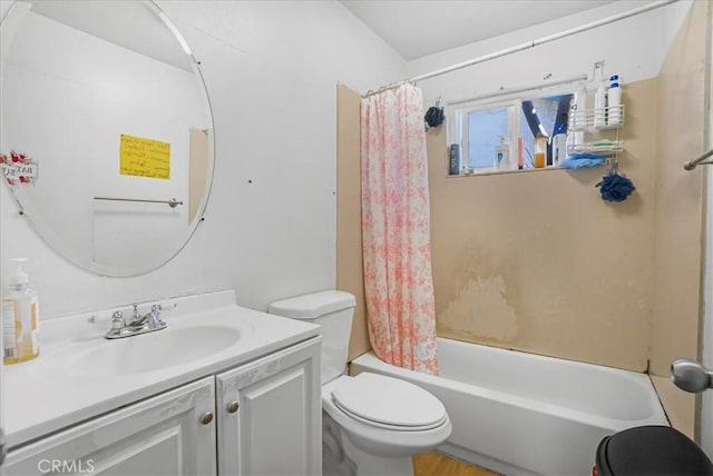 bathroom featuring shower / tub combo with curtain, toilet, and vanity