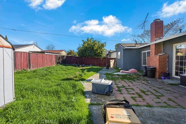 view of yard featuring a patio and a fenced backyard