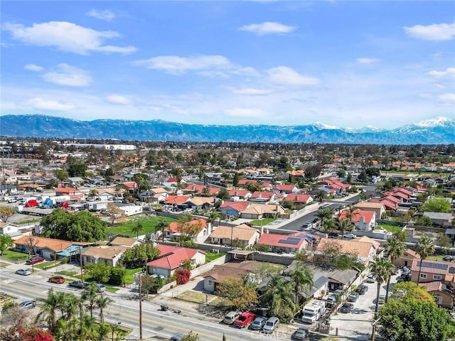 drone / aerial view featuring a residential view and a mountain view