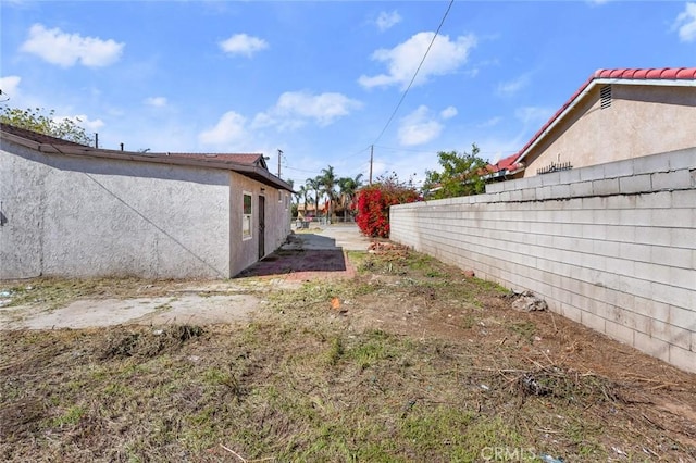 view of yard with fence