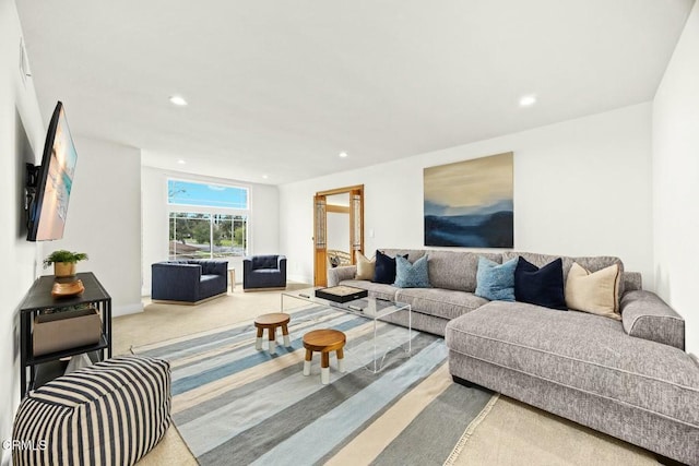 living area featuring carpet flooring, recessed lighting, and baseboards