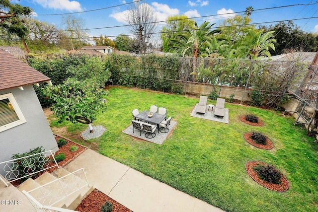 view of yard with a fenced backyard and a patio area