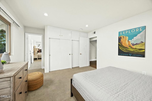 bedroom with carpet flooring, recessed lighting, visible vents, and a closet