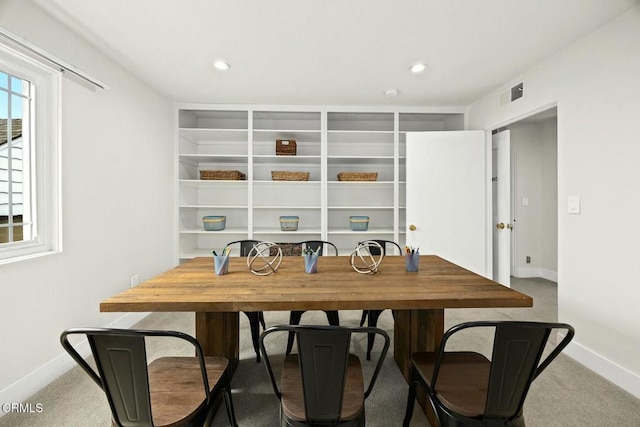 carpeted dining room with recessed lighting, visible vents, and baseboards